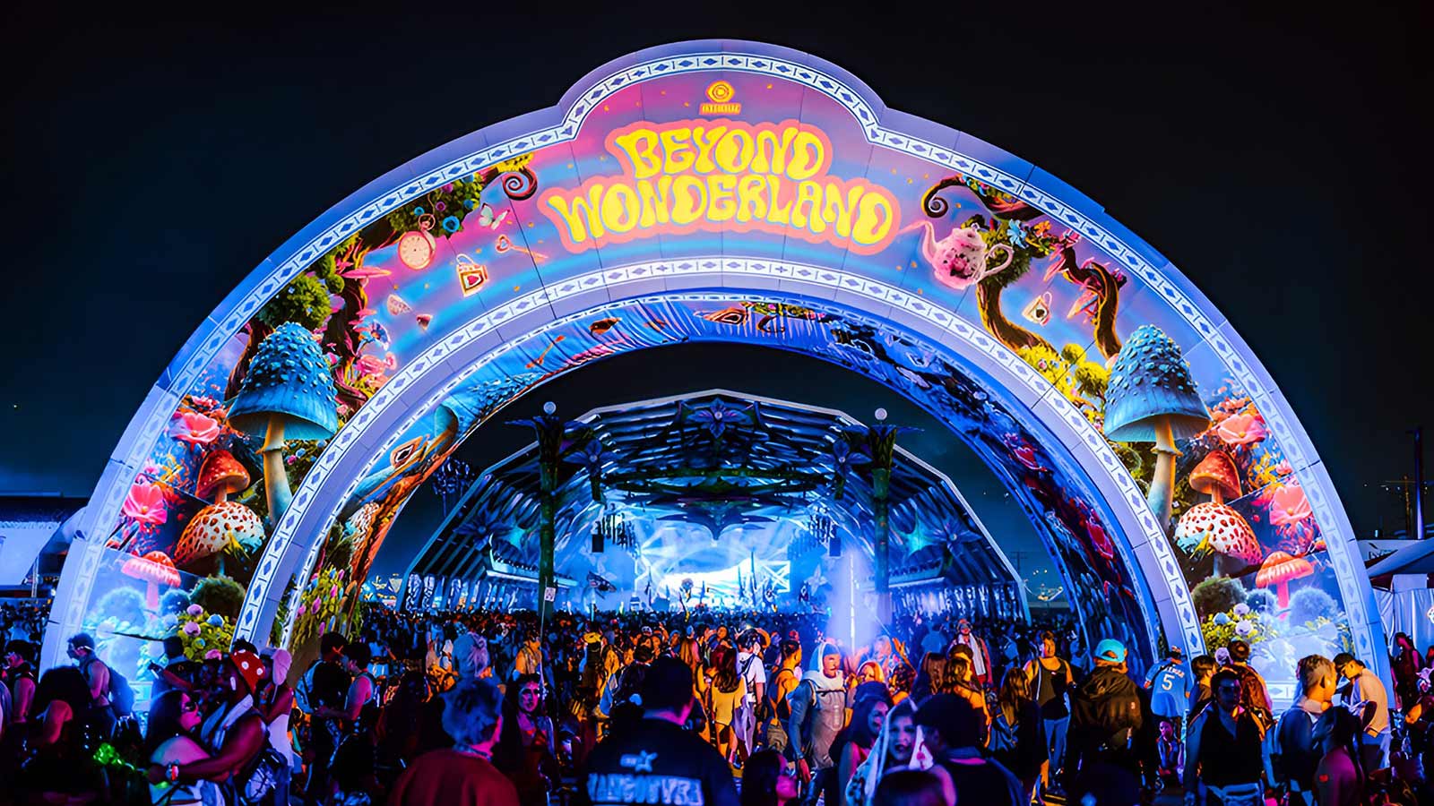 Beyond Wonderland entrance arch lit up at night